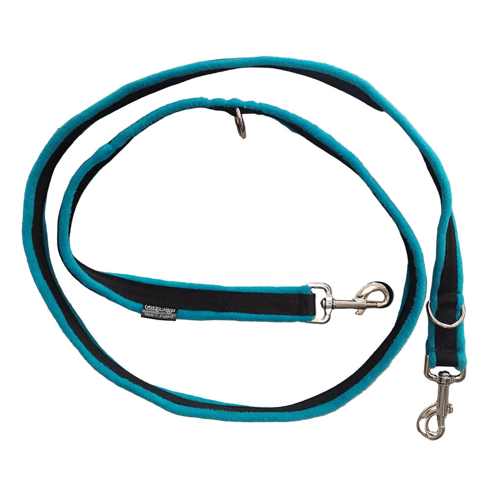 A plush dog leash in turquoise and black with silver metal hardware, coiled on a white background. The brand name 'CosyDogs' is visible on a small fabric tag.